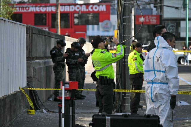 Police work outside the Ministry of Agriculture building, where a controlled explosion of a bomb was conducted, in Quito on June 29, 2026. Ecuadoran police conducted a controlled explosion of a bomb planted outside the Ministry of Agriculture shattering windows there. It was the second time in five days that a bomb has been found in the capital Quito, and comes as Ecuador grapples with rising violence by drug cartels. (Photo by Rodrigo BUENDIA / AFP)
