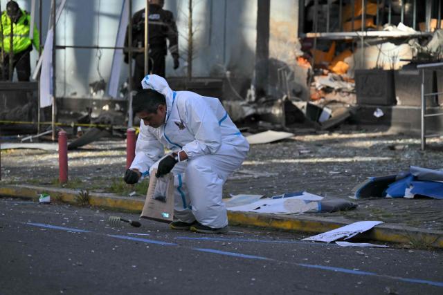 Police work outside the Ministry of Agriculture building, where a controlled explosion of a bomb was conducted, in Quito on June 29, 2026. Ecuadoran police conducted a controlled explosion of a bomb planted outside the Ministry of Agriculture shattering windows there. It was the second time in five days that a bomb has been found in the capital Quito, and comes as Ecuador grapples with rising violence by drug cartels. (Photo by Rodrigo BUENDIA / AFP)