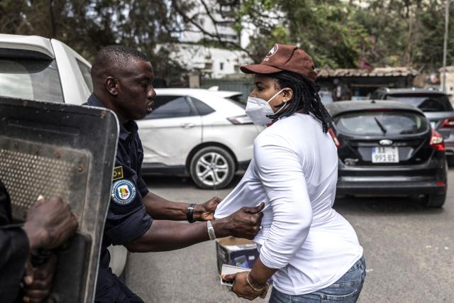 A Senegalese police officer arrests a protester during a demonstration against a constitutional reform bill near the National Assembly in Dakar, on June 29, 2026. Senegal’s National Assembly was examining, in a tense atmosphere marked by heated exchanges between lawmakers and clashes between demonstrators and police outside the building, a bill revising the Constitution concerning the powers of the President, Parliament, and the Prime Minister. The initiative, put forward by the parliamentary majority and its leader Ousmane Sonko, comes amid a deep disagreement with the country’s president. (Photo by PATRICK MEINHARDT / AFP)