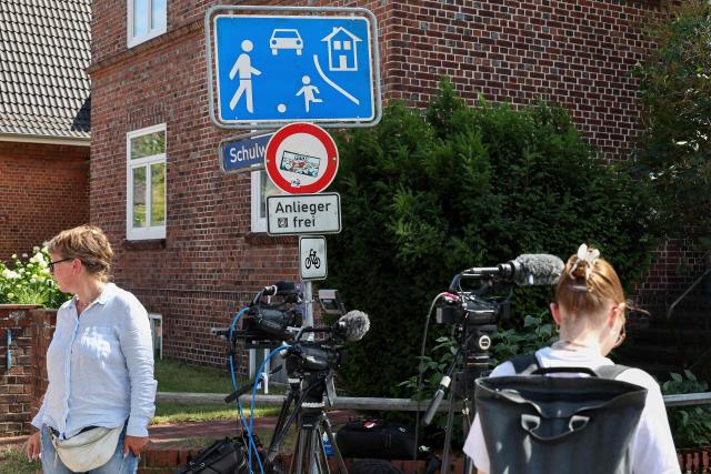 Journalists work near the scene where five people were killed in a shooting in Stade, northern Germany, a city some 50 kilometres west of Hamburg, on June 29, 2026. German police said five people were killed and others injured on June 29, 2026 in a shooting in a youth welfare facility in the northern city of Stade. Two people were arrested, including the suspected shooter, and there was now "no danger to the public", local police said in an update around 1215 GMT. (Photo by Ibrahim OT / AFP)
