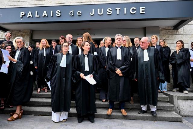 President of Bayonne's judicial court Florence Bouvier (C) delivers a speech during a gathering of judges, lawyers, clerks, civil servants and staff in front of the steps of the courthouse following the plenary general assembly of the Bayonne Judicial Court to express solidarity with Lyhanna's family and to demand more structural resources for justice in Bayonne, south-western France on June 29, 2026. (Photo by Gaizka IROZ / AFP)