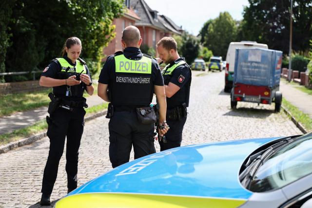 Police work near the scene where five people were killed in a shooting in Stade, northern Germany, a city some 50 kilometres west of Hamburg, on June 29, 2026. German police said five people were killed and others injured on June 29, 2026 in a shooting in a youth welfare facility in the northern city of Stade. Two people were arrested, including the suspected shooter, and there was now "no danger to the public", local police said in an update around 1215 GMT. (Photo by Ibrahim OT / AFP)