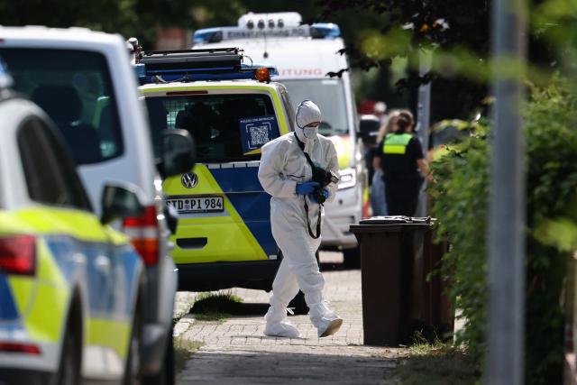 A forensic Police officer with a camera works near the scene where five people were killed in a shooting in Stade, northern Germany, a city some 50 kilometres west of Hamburg, on June 29, 2026. German police said five people were killed and others injured on June 29, 2026 in a shooting in a youth welfare facility in the northern city of Stade. Two people were arrested, including the suspected shooter, and there was now "no danger to the public", local police said in an update around 1215 GMT. (Photo by Ibrahim OT / AFP)