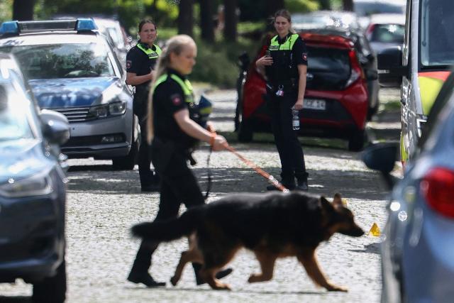 Police use a dog as they investigate near the scene where five people were killed in a shooting in Stade, northern Germany, a city some 50 kilometres west of Hamburg, on June 29, 2026. German police said five people were killed and others injured on June 29, 2026 in a shooting in a youth welfare facility in the northern city of Stade. Two people were arrested, including the suspected shooter, and there was now "no danger to the public", local police said in an update around 1215 GMT. (Photo by Ibrahim OT / AFP) / ALTERNATIVE CROP