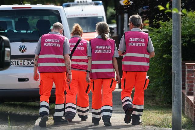 Members of a crisis intervention team work near the scene where five people were killed in a shooting in Stade, northern Germany, a city some 50 kilometres west of Hamburg, on June 29, 2026. German police said five people were killed and others injured on June 29, 2026 in a shooting in a youth welfare facility in the northern city of Stade. Two people were arrested, including the suspected shooter, and there was now "no danger to the public", local police said in an update around 1215 GMT. (Photo by Ibrahim OT / AFP)