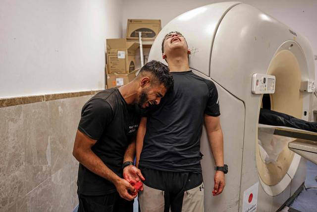 Relatives mourn the death of Amir Ahmad Jawad Jaber, a Palestinian teenager who was killed during an Israeli raid, at a hospital in Ramallah, in the Israeli-occupied West Bank on June 29, 2026. Israeli forces fatally shot a 15-year-old Palestinian teenager during a raid in the occupied West Bank on June 29, the Palestinian health ministry said, as violence surges in the Israeli-occupied territory. (Photo by Zain JAAFAR / AFP)