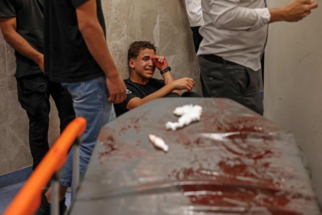 A relative mourns the death of Amir Ahmad Jawad Jaber, a Palestinian teenager who was killed during an Israeli raid, at a hospital in Ramallah, in the Israeli-occupied West Bank on June 29, 2026. Israeli forces fatally shot a 15-year-old Palestinian teenager during a raid in the occupied West Bank on June 29, the Palestinian health ministry said, as violence surges in the Israeli-occupied territory. (Photo by Zain JAAFAR / AFP)