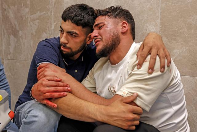 Relatives mourn the death of Amir Ahmad Jawad Jaber, a Palestinian teenager who was killed during an Israeli raid, at a hospital in Ramallah, in the Israeli-occupied West Bank on June 29, 2026. Israeli forces fatally shot a 15-year-old Palestinian teenager during a raid in the occupied West Bank on June 29, the Palestinian health ministry said, as violence surges in the Israeli-occupied territory. (Photo by Zain JAAFAR / AFP)
