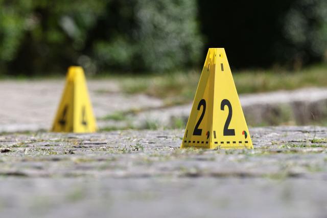 Police evidence markers are seen near the scene where five people were killed in a shooting in Stade, northern Germany, a city some 50 kilometres west of Hamburg, on June 29, 2026. German police said five people were killed and others injured on June 29, 2026 in a shooting in a youth welfare facility in the northern city of Stade. Two people were arrested, including the suspected shooter, and there was now "no danger to the public", local police said in an update around 1215 GMT. (Photo by Ibrahim OT / AFP)