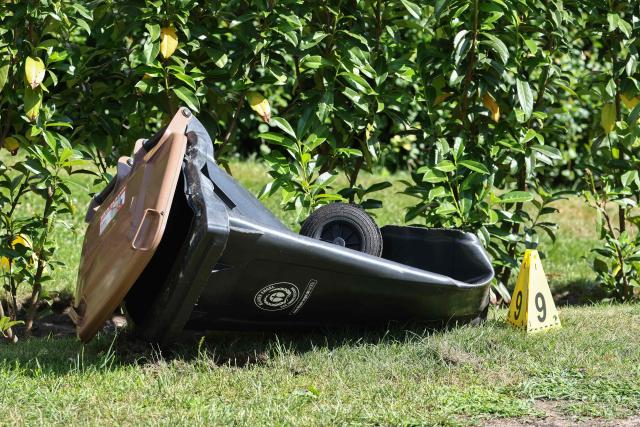 A Police evidence marker is seen next to a rubbish bin near the scene where five people were killed in a shooting in Stade, northern Germany, a city some 50 kilometres west of Hamburg, on June 29, 2026. German police said five people were killed and others injured on June 29, 2026 in a shooting in a youth welfare facility in the northern city of Stade. Two people were arrested, including the suspected shooter, and there was now "no danger to the public", local police said in an update around 1215 GMT. (Photo by Ibrahim OT / AFP)