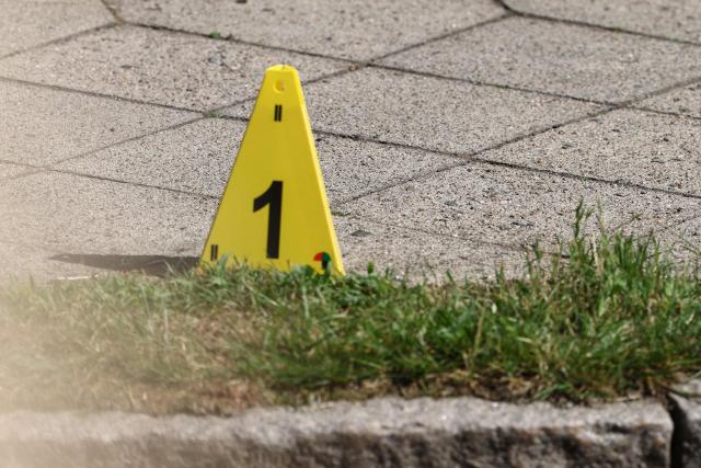 A Police evidence marker is seen near the scene where five people were killed in a shooting in Stade, northern Germany, a city some 50 kilometres west of Hamburg, on June 29, 2026. German police said five people were killed and others injured on June 29, 2026 in a shooting in a youth welfare facility in the northern city of Stade. Two people were arrested, including the suspected shooter, and there was now "no danger to the public", local police said in an update around 1215 GMT. (Photo by Ibrahim OT / AFP)