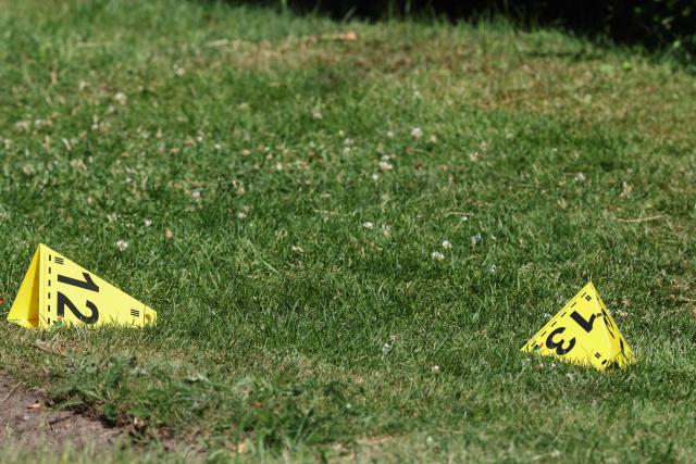 Police evidence markers are seen near the scene where five people were killed in a shooting in Stade, northern Germany, a city some 50 kilometres west of Hamburg, on June 29, 2026. German police said five people were killed and others injured on June 29, 2026 in a shooting in a youth welfare facility in the northern city of Stade. Two people were arrested, including the suspected shooter, and there was now "no danger to the public", local police said in an update around 1215 GMT. (Photo by Ibrahim OT / AFP)