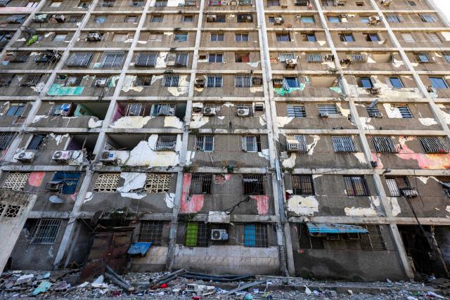 A dammaged building is pictured in Catia La Mar, La Guaira state, Venezuela, on June 29, 2026. Hopes were fading on June 29, 2026 of finding survivors more than four days after powerful twin earthquakes struck Venezuela, as residents grow increasingly frustrated with the government's response to the disaster that has killed at least 1,450 people and left tens of thousands unaccounted for. (Photo by Miguel MEDINA / POOL / AFP)