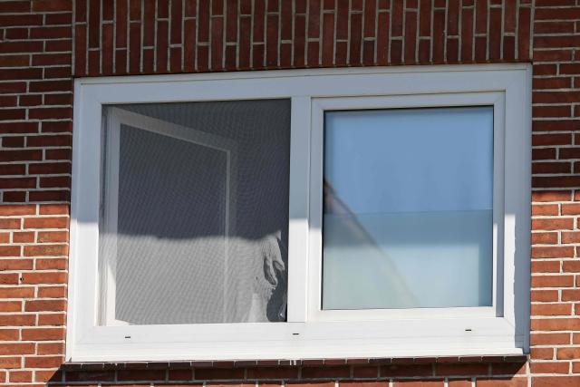 Picture taken on June 29, 2026 shows the window of a youth centre where a shooting took place in Stade, northern Germany, a city some 50 kilometres west of Hamburg. German police said six people were killed and others injured on June 29, 2026 in a shooting in a youth welfare facility in the northern city of Stade. Two people were arrested, including the suspected shooter, and there was now "no danger to the public", local police said in an update around 1215 GMT. (Photo by Ibrahim OT / AFP)