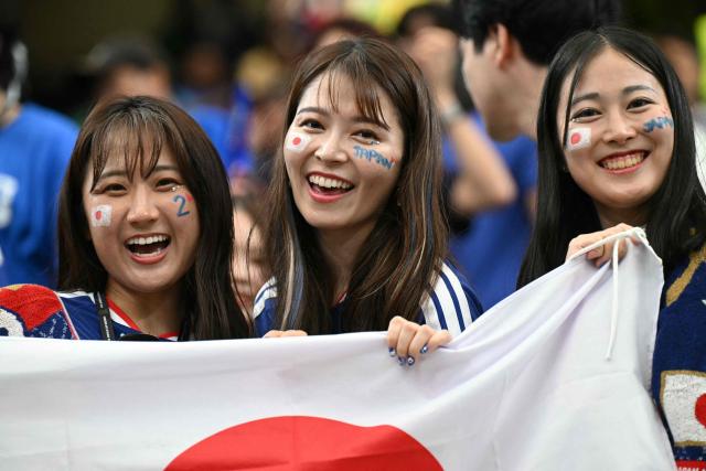 Japan's supporters pose ahead of the 2026 World Cup round of 32 football match between Brazil and Japan at the Houston Stadium in Houston on June 29, 2026.  (Photo by RONALDO SCHEMIDT / AFP)