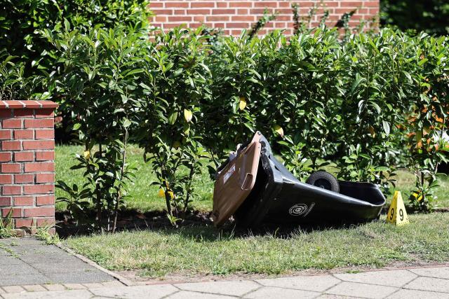 A Police evidence marker is seen next to a rubbish bin near the scene where five people were killed in a shooting in Stade, northern Germany, a city some 50 kilometres west of Hamburg, on June 29, 2026. German police said five people were killed and others injured on June 29, 2026 in a shooting in a youth welfare facility in the northern city of Stade. Two people were arrested, including the suspected shooter, and there was now "no danger to the public", local police said in an update around 1215 GMT. (Photo by Ibrahim OT / AFP)