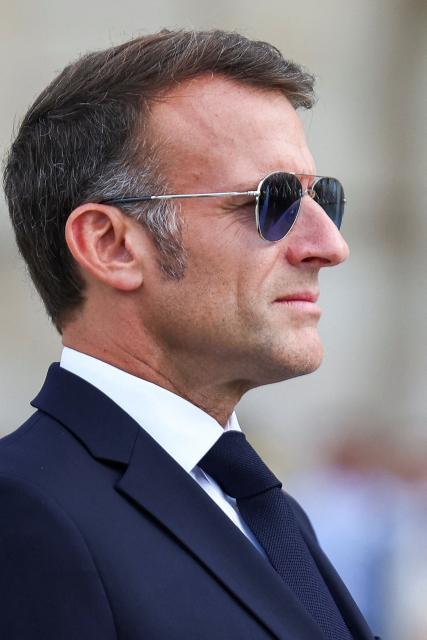 France's President Emmanuel Macron looks on during a welcoming ceremony for Thailand's King Maha Vajiralongkorn and Queen Suthida (not pictured) in the courtyard of the Hotel des Invalides in Paris on June 29, 2026, as part of an official state visit of the Thai King to France. The King of Thailand is visiting France from June 28 to July 2, the first by a Thai monarch to France since 1960, marking the 170th anniversary of the establishment of diplomatic relations between the two countries. (Photo by Abdul Saboor / POOL / AFP)
