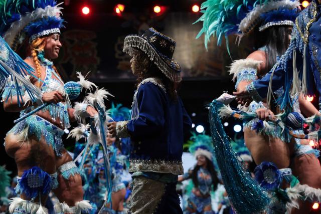 Members of a Batalhao (a dance and singing group) take part in a performance of the Bumba-Meu-Boi traditional festival, in Sao Luis, Maranhao State, northern Brazil, on June 26, 2026. Recognized by UNESCO as Intangible Cultural Heritage of Humanity, the Bumba-Meu-Boi festivities tell the legend of Pai Francisco and Mae Catirina, who sacrifice their employer’s favorite ox to fulfill the wish of his pregnant wife, culminating in the animal’s resurrection. (Photo by Antonello Veneri / AFP)