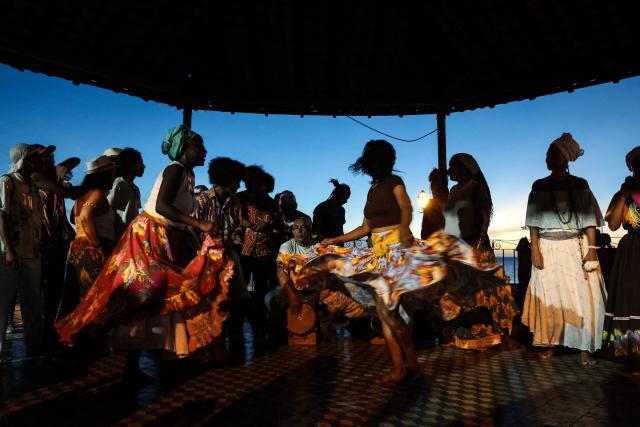 Members of a Batalhao (a dance and singing group) take part in a performance of the Bumba-Meu-Boi traditional festival, in Sao Luis, Maranhao State, northern Brazil, on June 26, 2026. Recognized by UNESCO as Intangible Cultural Heritage of Humanity, the Bumba-Meu-Boi festivities tell the legend of Pai Francisco and Mae Catirina, who sacrifice their employer’s favorite ox to fulfill the wish of his pregnant wife, culminating in the animal’s resurrection. (Photo by Antonello Veneri / AFP)