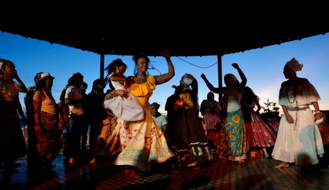 Members of a Batalhao (a dance and singing group) take part in a performance of the Bumba-Meu-Boi traditional festival, in Sao Luis, Maranhao State, northern Brazil, on June 26, 2026. Recognized by UNESCO as Intangible Cultural Heritage of Humanity, the Bumba-Meu-Boi festivities tell the legend of Pai Francisco and Mae Catirina, who sacrifice their employer’s favorite ox to fulfill the wish of his pregnant wife, culminating in the animal’s resurrection. (Photo by Antonello Veneri / AFP)