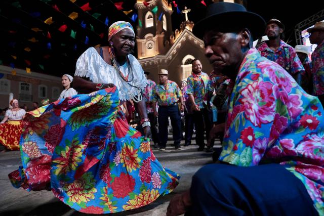 Members of a Batalhao (a dance and singing group) take part in a performance of the Bumba-Meu-Boi traditional festival, in Sao Luis, Maranhao State, northern Brazil, on June 26, 2026. Recognized by UNESCO as Intangible Cultural Heritage of Humanity, the Bumba-Meu-Boi festivities tell the legend of Pai Francisco and Mae Catirina, who sacrifice their employer’s favorite ox to fulfill the wish of his pregnant wife, culminating in the animal’s resurrection. (Photo by Antonello Veneri / AFP)