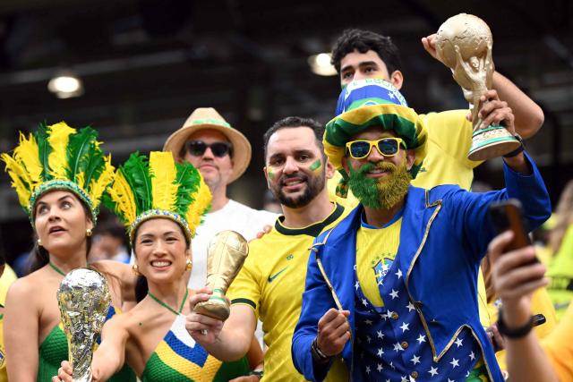Brazil's supporters pose ahead of the 2026 World Cup round of 32 football match between Brazil and Japan at the Houston Stadium in Houston on June 29, 2026.  (Photo by Paul ELLIS / AFP)