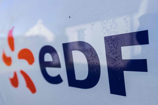 (FILES) A picture taken on January 18, 2022, shows the logo of EDF standing for "Electricity of France" in the town of Flamanville, northwestern France. French power giant EDF has signed a $3 billion (2.6 billion euros) contract to develop a pumped-storage hydropower plant in Oman, amid a state visit to France by the Sultan of Oman, French presidency said on June 29, 2026. (Photo by Sameer Al-DOUMY / AFP)