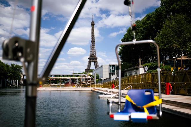 This photograph shows the Seine river at the Baignade de Grenelle Baignade safe swimming site with the Eiffel Tower in the background, in Paris on June 29, 2026. The Baignade de Grenelle Baignade safe swimming will open on July 4, 2026. (Photo by Julie SEBADELHA / AFP)