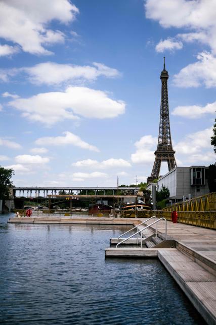 This photograph shows the Seine river at the Baignade de Grenelle Baignade safe swimming site with the Eiffel Tower in the background, in Paris on June 29, 2026. The Baignade de Grenelle Baignade safe swimming will open on July 4, 2026. (Photo by Julie SEBADELHA / AFP)