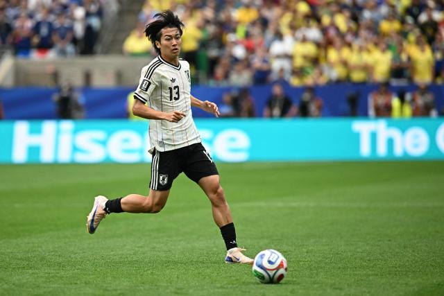 Japan's midfielder #13 Keito Nakamura runs with the ball during the 2026 World Cup round of 32 football match between Brazil and Japan at the Houston Stadium in Houston on June 29, 2026.  (Photo by Paul ELLIS / AFP)