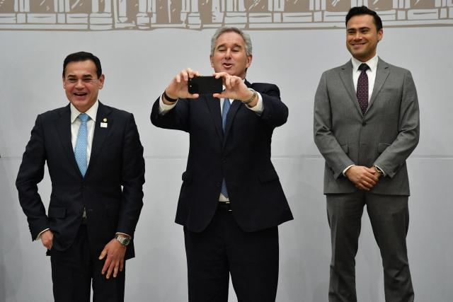 Argentina's Foreign Minister Pablo Quirno (C) takes a picture next to Paraguay's Foreign Minister Ruben Ramirez Lezcano (L) and Colombia's Minister Counselor, Miguel Dario Clavijo MacCormick, during the family photo of the 68th Mercosur Foreign Ministers’ Summit at the Conmebol headquarters in Luque, Paraguay, on June 29, 2026. (Photo by DANIEL DUARTE / AFP)