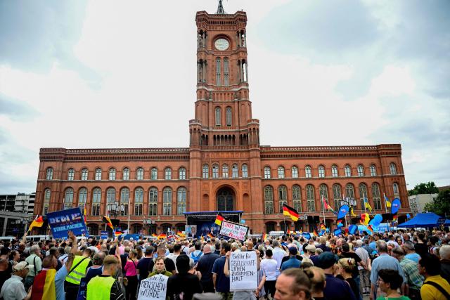 Supporters of the far-right Alternative for Germany (AfD) party attend a campaign rally in front ot the Berlin City Hall on June 29, 2026. (Photo by Tobias SCHWARZ / AFP)