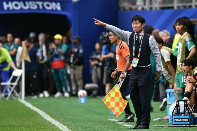 Japan's head coach Hajime Moriyasu gestures  during the 2026 World Cup round of 32 football match between Brazil and Japan at the Houston Stadium in Houston on June 29, 2026.  (Photo by Paul ELLIS / AFP)