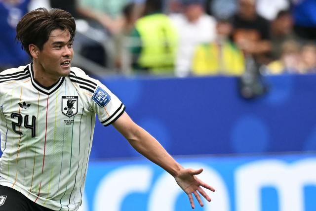 Japan's midfielder #24 Kaishu Sano celebrates after scoring the opening goal during the 2026 World Cup round of 32 football match between Brazil and Japan at the Houston Stadium in Houston on June 29, 2026.  (Photo by Paul ELLIS / AFP)