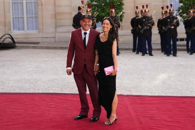 French fashion designer Christian Louboutin (L) arrives at The Elysee Presidential Palace for a working dinner with France's President and Thailand's King Maha Vajiralongkorn as part of the Thai King's State visit to France, in Paris on June 29, 2026. (Photo by Dimitar DILKOFF / AFP)
