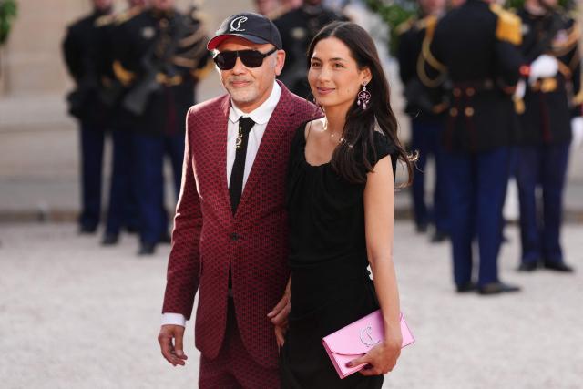French fashion designer Christian Louboutin (L) arrives at The Elysee Presidential Palace for a working dinner with France's President and Thailand's King Maha Vajiralongkorn as part of the Thai King's State visit to France, in Paris on June 29, 2026. (Photo by Dimitar DILKOFF / AFP)