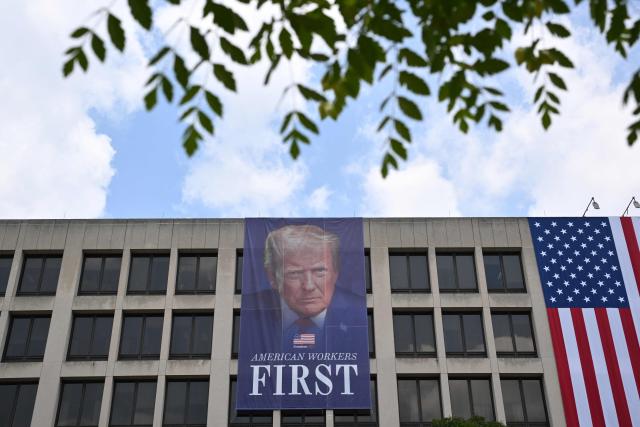 A banner of US President Donald Trump is seen on the side of the US Department of Labor headquarters building in Washington, DC, on June 29, 2026. (Photo by Mandel NGAN / AFP)