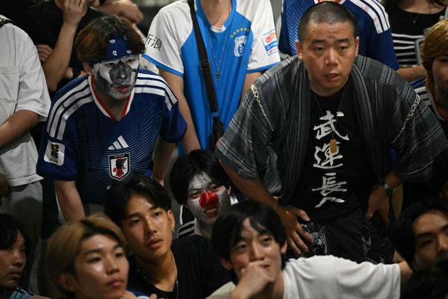 Fans watch the 2026 World Cup Group F football match between Japan and Brazil in Tokyo's Shibuya district early on June 30, 2026. (Photo by Philip FONG / AFP)