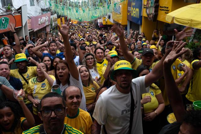 Brazilian fans watch a live broadcast of the 2026 FIFA World Cup football match between Brazil and Japan in the Rocinha favela, Rio de Janeiro, Brazil, on June 29, 2026. (Photo by TERCIO TEIXEIRA / AFP)