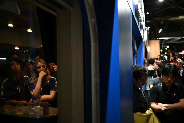 Fans watch the 2026 World Cup Group F football match between Japan and Brazil at a sports bar in Tokyo early on June 30, 2026. (Photo by Philip FONG / AFP)