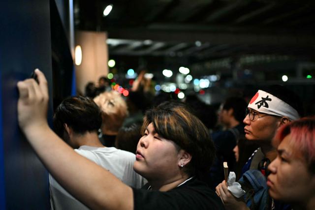Fans watch the 2026 World Cup Group F football match between Japan and Brazil at a sports bar in Tokyo early on June 30, 2026. (Photo by Philip FONG / AFP)
