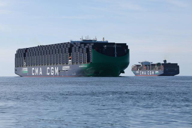 CMA-CMG container ship the 'Notre Dame', France's largest container ship, sails past another CMA-CMG container ship as it approaches the northern port of Le Havre on June 29, 2026. (Photo by ALAIN JOCARD / AFP)
