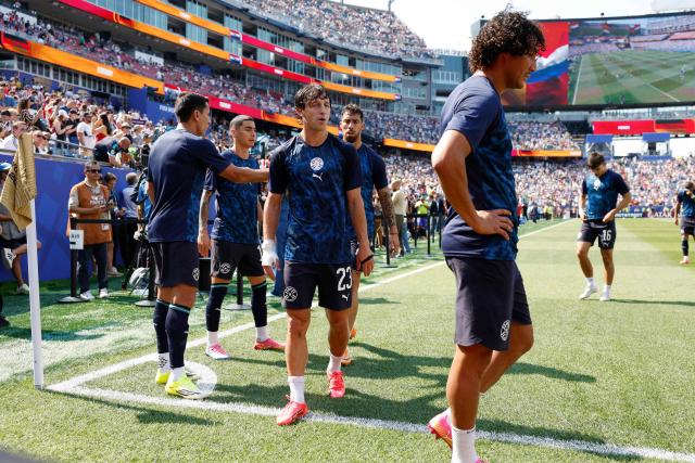 Paraguay's midfielder #23 Matias Galarza and teammates warm up ahead of the 2026 World Cup round of 32 football match between Germany and Paraguay at the Boston Stadium in Foxborough on June 29, 2026.  (Photo by Odd ANDERSEN / AFP)