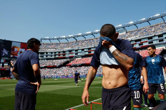Paraguay's defender #04 Juan Jose Caceres covers his face as he warms up ahead of the 2026 World Cup round of 32 football match between Germany and Paraguay at the Boston Stadium in Foxborough on June 29, 2026.  (Photo by Odd ANDERSEN / AFP)