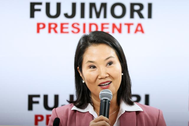 (FILES) Peru's presidential candidate for the Fuerza Popular party, Keiko Fujimori, speaks at her campaign headquarters in Lima on June 24, 2026. Right-wing candidate Keiko Fujimori won Peru's presidential run-off with a wafer-thin majority of 50.13 percent of the vote, the country's election commission said on June 29, 2026. (Photo by Connie FRANCE / AFP)