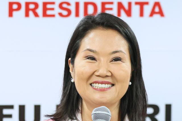 (FILES) Peru's presidential candidate for the Fuerza Popular party, Keiko Fujimori, speaks at her campaign headquarters in Lima on June 24, 2026. Right-wing candidate Keiko Fujimori won Peru's presidential run-off with a wafer-thin majority of 50.13 percent of the vote, the country's election commission said on June 29, 2026. (Photo by Connie FRANCE / AFP)
