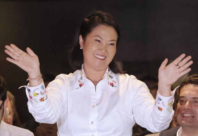 (FILES) Peru's presidential candidate Keiko Fujimori, for the Fuerza Popular party, waves after a speech following the first results of the presidential election runoff in Lima on June 7, 2026. Right-wing candidate Keiko Fujimori won Peru's presidential run-off with a wafer-thin majority of 50.13 percent of the vote, the country's election commission said on June 29, 2026. (Photo by Anthony Nino de Guzman / AFP)