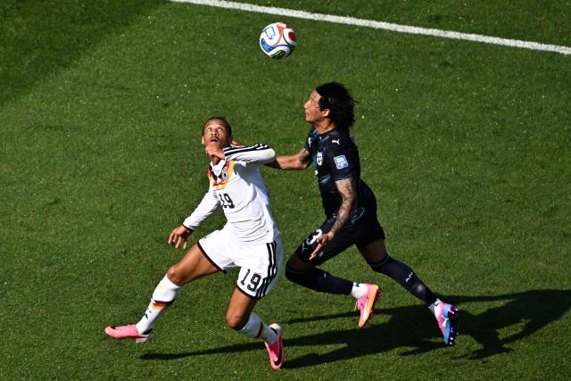 Germany's forward #19 Leroy Sane and Paraguay's defender #13 Jose Canale fight for the ball during the 2026 World Cup round of 32 football match between Germany and Paraguay at the Boston Stadium in Foxborough on June 29, 2026.  (Photo by Jewel SAMAD / AFP)