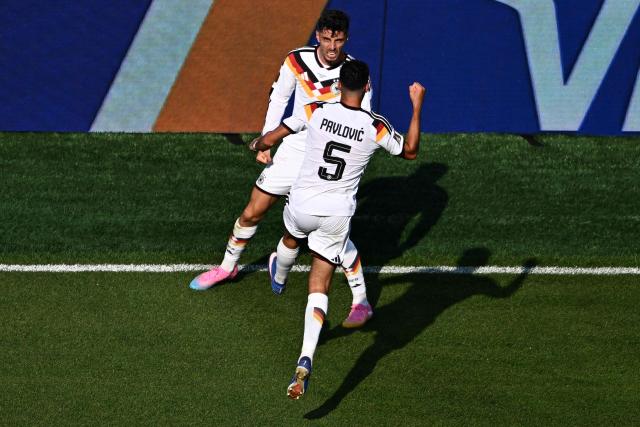Germany's forward #07 Kai Havertz celebrates scoring his team's first goal with teammate defender #05 Aleksandar Pavlovic during the 2026 World Cup round of 32 football match between Germany and Paraguay at the Boston Stadium in Foxborough on June 29, 2026.  (Photo by Jewel SAMAD / AFP)