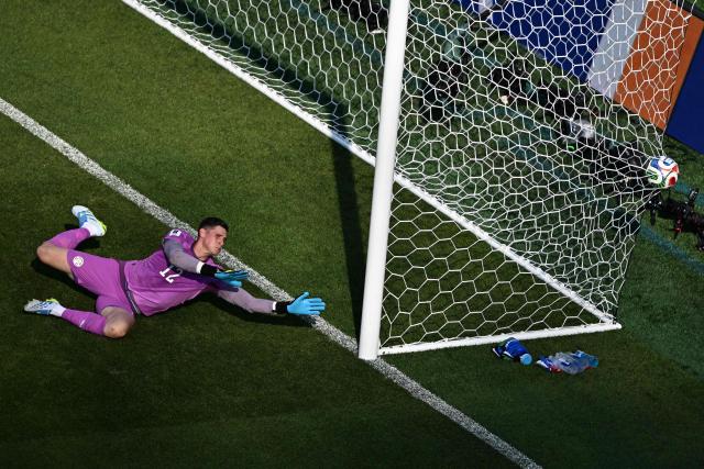 Paraguay's goalkeeper #12 Orlando Gill concedes Germany's first goal scored by forward #07 Kai Havertz (unseen) during the 2026 World Cup round of 32 football match between Germany and Paraguay at the Boston Stadium in Foxborough on June 29, 2026.  (Photo by Jewel SAMAD / AFP)